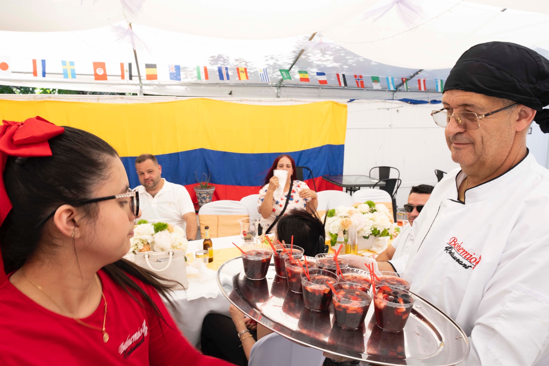 Chef and owner serving sangria at a private event